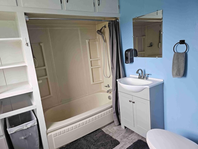 393 Main St, Limestone, ME 04750 - full bath featuring vanity, shower / tub combo with curtain, toilet, and baseboard heating