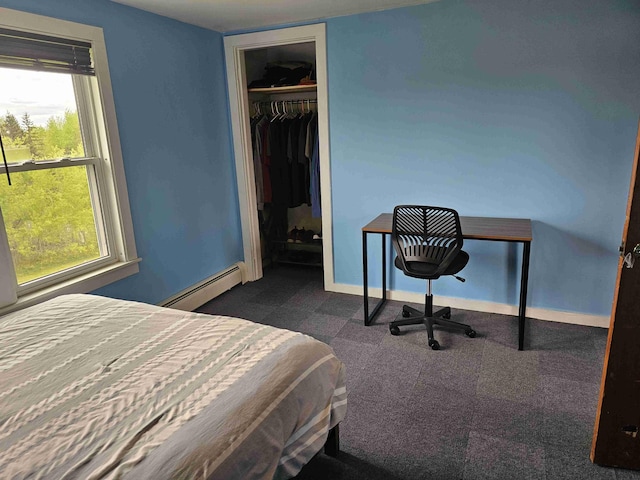 393 Main St, Limestone, ME 04750 - carpeted bedroom with baseboard heating, baseboards, multiple windows, and a closet