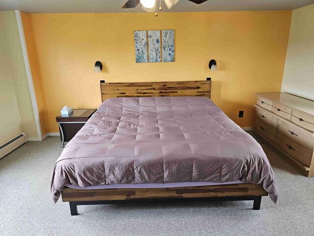 393 Main St, Limestone, ME 04750 - bedroom featuring carpet flooring, baseboards, a ceiling fan, and a baseboard radiator