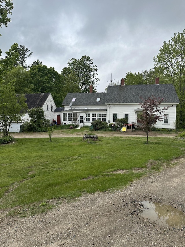 210 Ferguson Rd, Shapleigh, ME 04076 - view of front of property featuring a chimney and a front yard