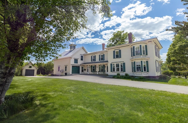 34 Mcphetres Rd, Sangerville, ME 04479 - rear view of property featuring a chimney and a lawn
