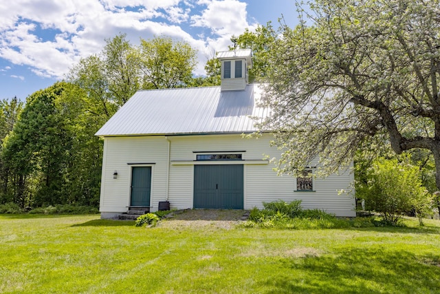 34 Mcphetres Rd, Sangerville, ME 04479 - rear view of property featuring a lawn and metal roof