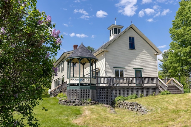 34 Mcphetres Rd, Sangerville, ME 04479 - rear view of property featuring a lawn, stairway, and a deck