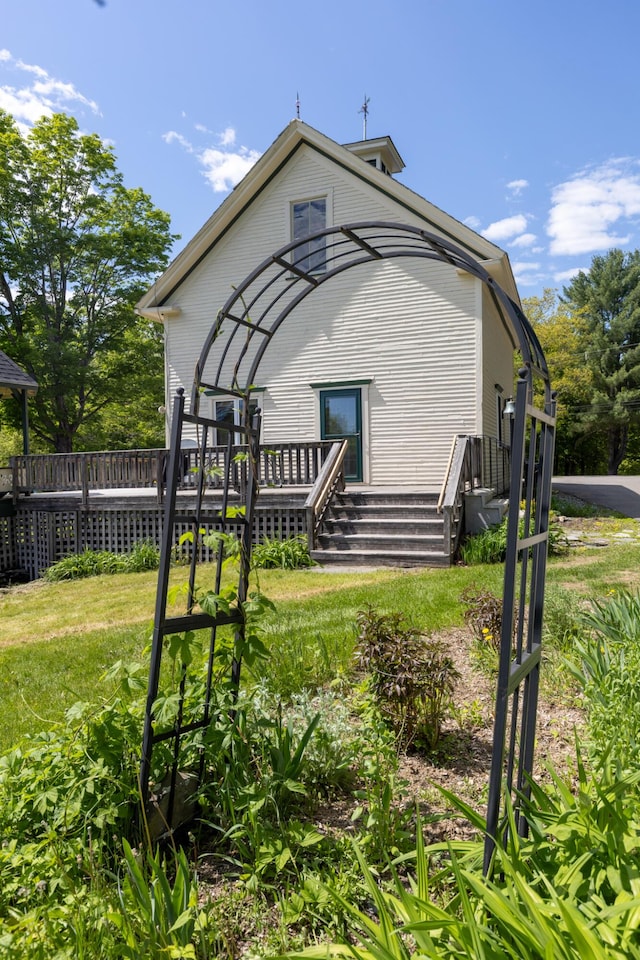 34 Mcphetres Rd, Sangerville, ME 04479 - rear view of house featuring a deck and a yard