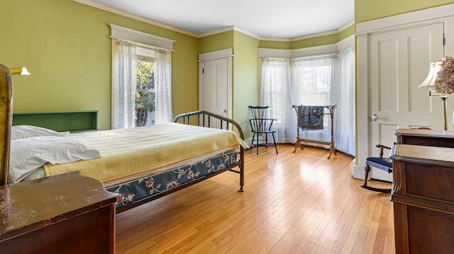 34 Mcphetres Rd, Sangerville, ME 04479 - bedroom with light wood-style flooring and crown molding