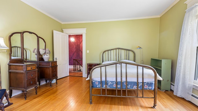 34 Mcphetres Rd, Sangerville, ME 04479 - bedroom featuring hardwood / wood-style flooring, ornamental molding, and baseboard heating