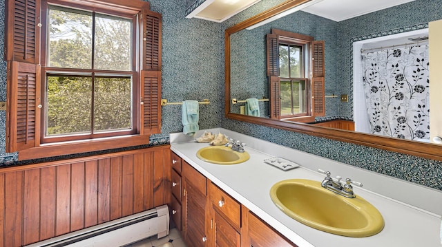 34 Mcphetres Rd, Sangerville, ME 04479 - bathroom featuring a baseboard heating unit, double vanity, and wallpapered walls