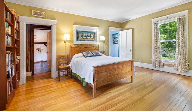 34 Mcphetres Rd, Sangerville, ME 04479 - bedroom with light wood-style flooring, ornamental molding, and baseboards