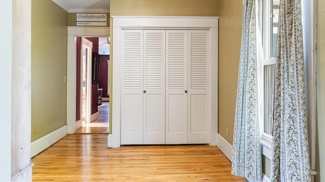 34 Mcphetres Rd, Sangerville, ME 04479 - unfurnished bedroom with light wood-type flooring, a closet, crown molding, and baseboards