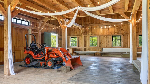34 Mcphetres Rd, Sangerville, ME 04479 - misc room with hardwood / wood-style flooring, wooden walls, and high vaulted ceiling