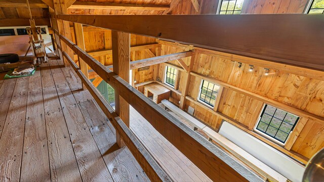 34 Mcphetres Rd, Sangerville, ME 04479 - stairway with wood-type flooring, healthy amount of natural light, wood ceiling, and wooden walls