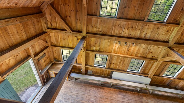 34 Mcphetres Rd, Sangerville, ME 04479 - unfurnished bedroom with wood-type flooring, wood walls, vaulted ceiling, and wood ceiling