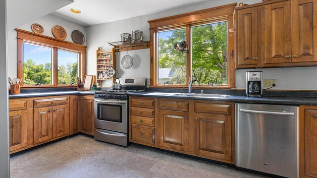 34 Mcphetres Rd, Sangerville, ME 04479 - kitchen with appliances with stainless steel finishes, a sink, brown cabinets, and dark countertops