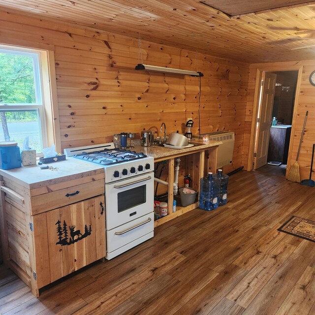 849 N Rd, Medford, ME 04463 - kitchen with white gas range oven, hardwood / wood-style floors, wood walls, wooden ceiling, and light countertops