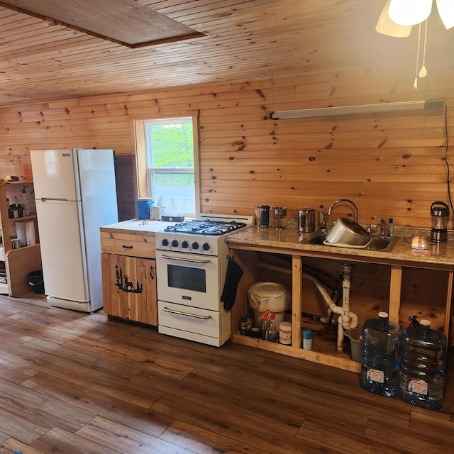 849 N Rd, Medford, ME 04463 - kitchen with white appliances, a sink, wooden ceiling, dark wood-style flooring, and wood walls