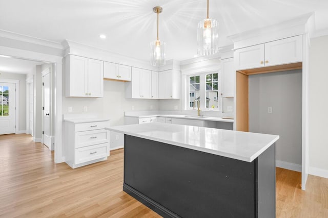 81 Creeks Edge Dr Unit 0, Saco, ME 04072 - kitchen with plenty of natural light, white cabinets, light wood finished floors, ornamental molding, and recessed lighting
