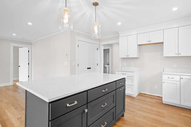 81 Creeks Edge Dr Unit 0, Saco, ME 04072 - kitchen featuring white cabinetry, crown molding, light countertops, light wood-style flooring, and recessed lighting