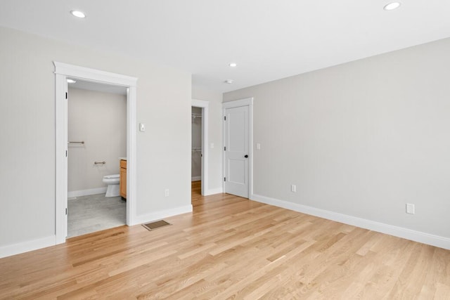 81 Creeks Edge Dr Unit 0, Saco, ME 04072 - unfurnished bedroom with recessed lighting, light wood-type flooring, ensuite bath, a walk in closet, and a closet