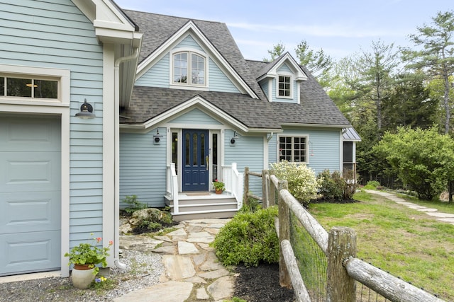 49 Moose Walk Rd, Westport Island, ME 04578 - view of front facade with a shingled roof and a garage