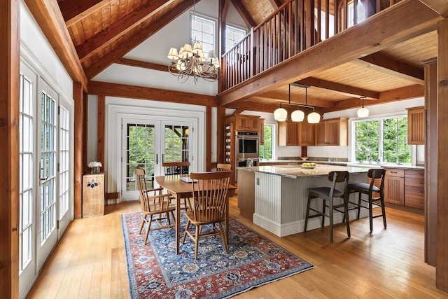 49 Moose Walk Rd, Westport Island, ME 04578 - dining area with french doors, light wood-style flooring, a chandelier, and beam ceiling