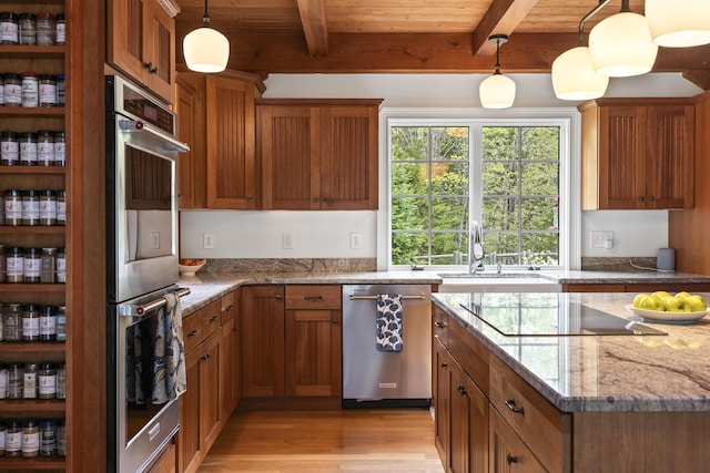 49 Moose Walk Rd, Westport Island, ME 04578 - kitchen featuring appliances with stainless steel finishes, brown cabinets, light wood-style flooring, a sink, and wood ceiling with exposed beams