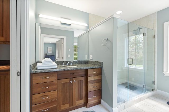 49 Moose Walk Rd, Westport Island, ME 04578 - full bath with tile patterned floors, vanity, a stall shower, and baseboards