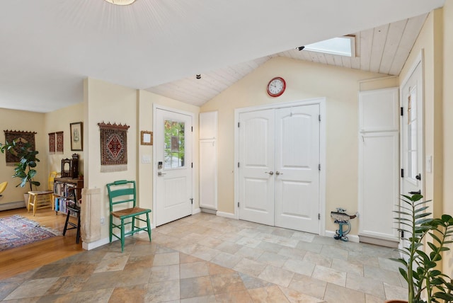47 Woods Circle Rd, Yarmouth, ME 04096 - entrance foyer with a skylight, vaulted ceiling, light stone finish floors, baseboards, and wooden ceiling