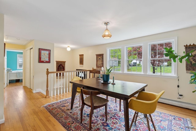 47 Woods Circle Rd, Yarmouth, ME 04096 - dining room featuring light wood-style floors, baseboards, and a baseboard heating unit