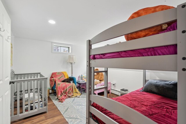47 Woods Circle Rd, Yarmouth, ME 04096 - bedroom with baseboard heating, wood finished floors, and recessed lighting