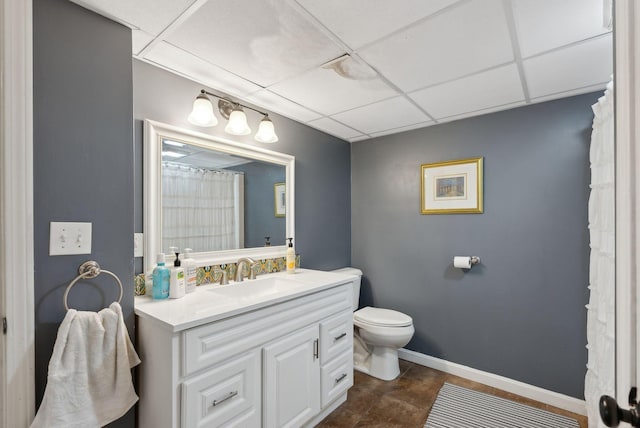 47 Woods Circle Rd, Yarmouth, ME 04096 - bathroom with toilet, vanity, a drop ceiling, baseboards, and curtained shower