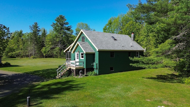 189 Stetson Rd E, Levant, ME 04456 - view of home's exterior with a lawn and a chimney
