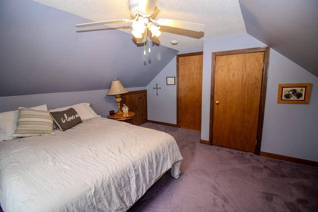 189 Stetson Rd E, Levant, ME 04456 - carpeted bedroom featuring vaulted ceiling, ceiling fan, two closets, baseboards, and a textured ceiling