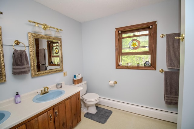189 Stetson Rd E, Levant, ME 04456 - full bath featuring baseboard heating, toilet, and double vanity