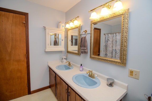 189 Stetson Rd E, Levant, ME 04456 - bathroom with double vanity and baseboards