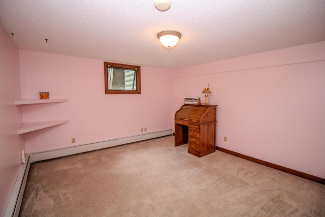 189 Stetson Rd E, Levant, ME 04456 - unfurnished bedroom with light colored carpet, baseboard heating, baseboards, and a textured ceiling