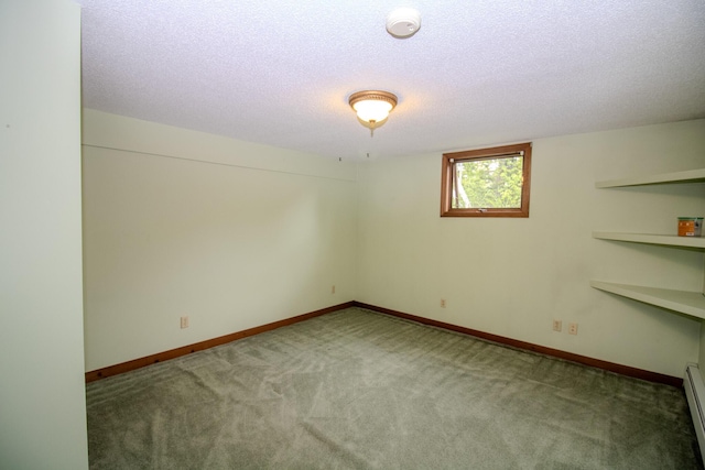 189 Stetson Rd E, Levant, ME 04456 - carpeted spare room featuring baseboard heating, a textured ceiling, baseboards, and a smoke detector