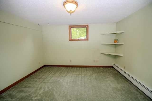 189 Stetson Rd E, Levant, ME 04456 - carpeted empty room featuring a baseboard heating unit, baseboards, and a textured ceiling