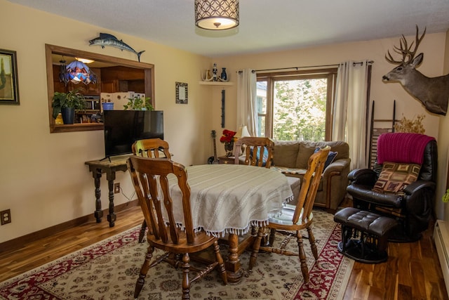189 Stetson Rd E, Levant, ME 04456 - dining space featuring wood finished floors, baseboards, and baseboard heating