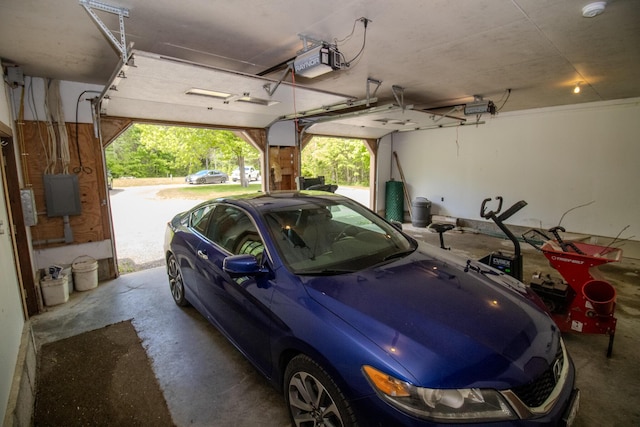 189 Stetson Rd E, Levant, ME 04456 - garage featuring a garage door opener and electric panel