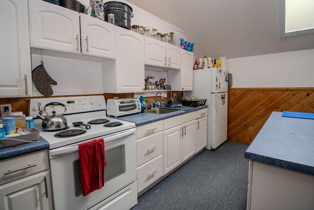 189 Stetson Rd E, Levant, ME 04456 - kitchen with white appliances, a sink, white cabinetry, carpet floors, and wood walls