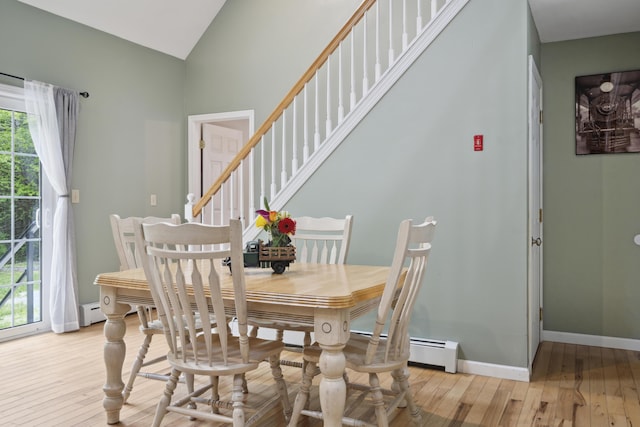 44 Emery Mills Rd, Lebanon, ME 04027 - dining space with light wood-style flooring, vaulted ceiling, stairway, and baseboards