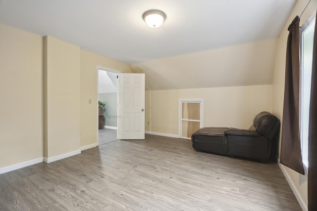 44 Emery Mills Rd, Lebanon, ME 04027 - living area featuring light wood-style floors, lofted ceiling, and baseboards