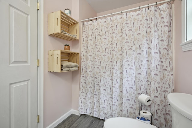 44 Emery Mills Rd, Lebanon, ME 04027 - bathroom with toilet, wood finished floors, baseboards, and curtained shower