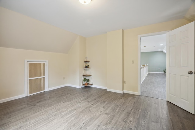 44 Emery Mills Rd, Lebanon, ME 04027 - empty room featuring vaulted ceiling, wood finished floors, and baseboards
