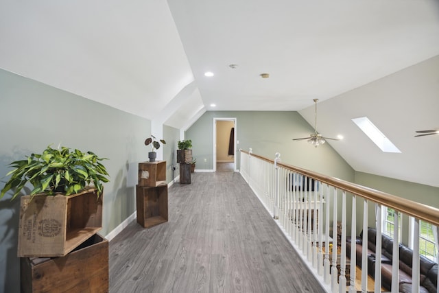 44 Emery Mills Rd, Lebanon, ME 04027 - corridor with a skylight, vaulted ceiling, wood finished floors, recessed lighting, and baseboards