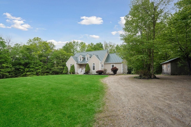 44 Emery Mills Rd, Lebanon, ME 04027 - view of front facade featuring a standing seam roof, driveway, a front yard, and metal roof