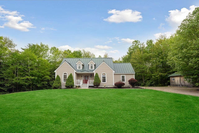44 Emery Mills Rd, Lebanon, ME 04027 - cape cod-style house featuring a standing seam roof, a front lawn, metal roof, and driveway