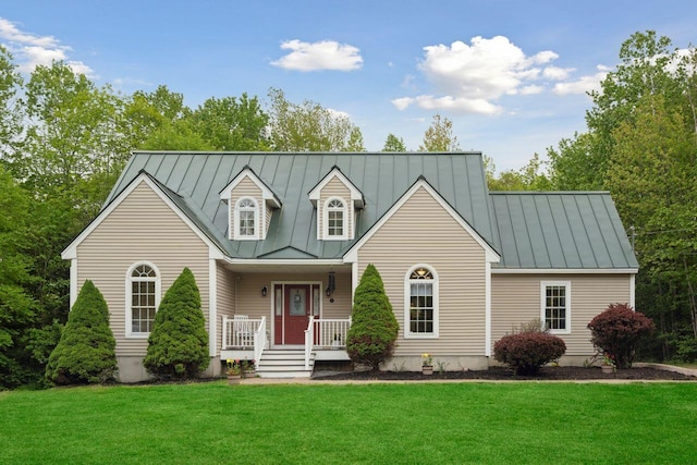 44 Emery Mills Rd, Lebanon, ME 04027 - new england style home with a standing seam roof, a porch, metal roof, and a front lawn