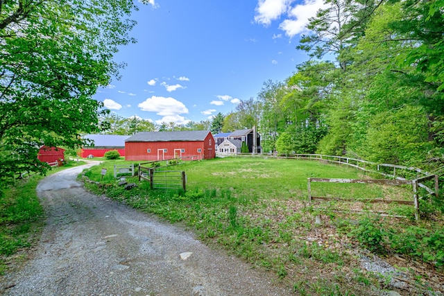 24 Cassella Dr, Jefferson, ME 04348 - view of yard featuring a barn, driveway, and an outdoor structure