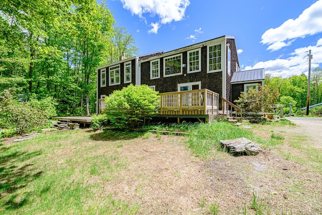 24 Cassella Dr, Jefferson, ME 04348 - back of house featuring a wooden deck and a chimney